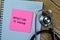Concept of Induction of Labour write on sticky notes with stethoscope isolated on Wooden Table
