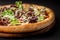 The concept of Italian cuisine. Real Italian pizza on a thin cake with large sides on a black background. Close up. Background