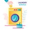 Concept of laundry service and launderette. Hand puts gold coin into big washing machine. Commercial washer, laundromat, laundry