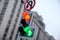 Concept of life way by traffic light with red light for straight direction but green arrow for right turn only with cloudy sky.