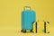 the concept of long journeys. luggage and a small suitcase on a yellow background. 3D render