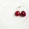 The concept of love - heart from berries of a sweet cherry.Isolated cherry. Heart shape from two cherries isolated white