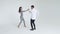 Concept of love, relationships and social dancing. Young beautiful couple dancing sensual dance on a white background