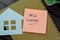 Concept of MLS Listing write on sticky notes isolated on Wooden Table