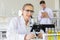 Concept of a new generation of scientific researchers looking through a microscope in a laboratory Young scientists are doing
