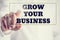 Concept of new or start up business - words Grow your business o