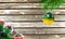 Concept of New Year and Christmas, on a wooden background, Christmas tree branches and a Christmas toy with the flag of