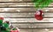 Concept of New Year and Christmas, on a wooden background, Christmas tree branches and a Christmas toy with the flag of Bermuda