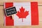 concept news feeds - Latest news, Canadian country's flag, blackboard with text Breaking News