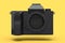 Concept of nonexistent gold DSLR camera isolated on yellow monochrome background