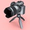 Concept of nonexistent silver DSLR camera with tripod isolated on pink.