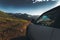 Concept Offroad Trip. Car On Mountains And Clouds Background. Road Adventure Vacation Concept