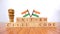 Concept of One law for all called Uniform Civil code or UCC in Indian constitution in wooden block letters and Indian flag as a