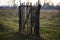 Concept one way , one exit, enter way out. Old wooden door on an empty green field