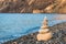 Concept photo balance - close-up of a pyramid of white stones on