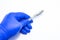 Concept photo surgery and surgical treatment, operations, procedures. Doctor holds in his hand, dressed in blue medical gloave, me