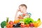 Concept photo of an unloved food - portrait of a boy with an aversion to vegetables and fruits on a white