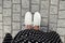 Concept picture of legs walking, Selfie of feet in white sneaker on rock pavement background, top view.