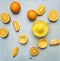 Concept of preparation of orange juice, sliced oranges, juicer on wooden rustic background top view close up