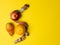 The concept of proper nutrition. Juicy fruit, Apple pear orange wrapped measuring tape on a bright yellow background.