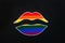 concept of rainbow lips on a black background, an LGBT symbol