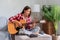 Concept of relaxation with music, Young woman sings and plays acoustic guitar after learning music