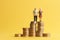 concept of retirement planning. Miniature elderly couple figure on a stack of coins