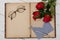 Concept romantic, old notebook, roses and glasses