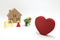Concept of safety image. Red heart shaped wood, house and construction tools of miniature on white back ground.