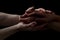 Concept of salvation. Hands of two people rescue, help. Helping hand, support. Isolated arm on black, charity. Devoted