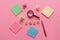 Concept of searching idea. Business flat lay with sticky notes, crumpled paper, magnifying glass and pen on pink background. Can
