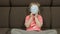 Concept of sick little girl wearing a medical mask. Quarantine. Making faces
