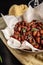 Concept of Spanish cuisine. Snack to wine or beer. Spicy almonds with pecias, rosemary, smoked paprkika, chili pepper, olive oil