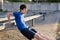 Concept of sports and health - teen boy training and pushups at the stadium. Physical exercise. Workout, fitness and health care
