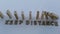 The concept of stopping the spread of the virus. Keep social distance. Stop coronavirus. A hand stops the domino effect in slow mo