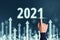 Concept for a successful year 2021 in business with abstract upward arrows