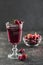 The concept of a summer refreshing drink from red berries: berry Morse of fresh strawberries and cranberries
