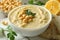 Concept of tasty eat with bowl of hummus, close up