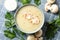 Concept of tasty lunch with bowl of mushroom soup on napkin background