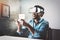 Concept of technology,gaming,entertainment and people.African man enjoying virtual reality glasses while relaxing in