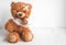 Concept teddy bear childhood diseases at textile background