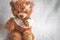 Concept teddy bear childhood diseases at textile background