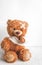 Concept teddy bear childhood diseases at textile background