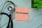 Concept of Testoterone write on sticky notes with stethoscope isolated on Wooden Table