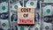 Concept text `cost of truth` on wooden blocks on a beautiful background from dollar bills