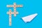 Concept on the theme of travel. White origami plane on a blue background