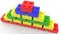 Concept of toy bricks in various colors stacked in pyramid