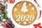 Concept with traditional Greek new year`s cake for 2020