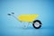 the concept of transportation of building materials. yellow trolley on a blue background. 3D render