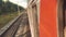 Concept travel train wagon journey. View through the train window of the wagons in the composition passing nature